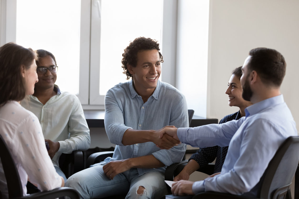 Businesspeople finish business meeting in office with shake hand The Role of Dialectical Behavior Therapy in Our Addiction Treatment
